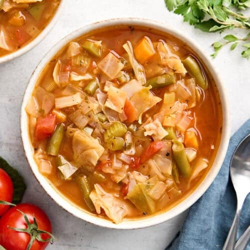 Overhead view of a bowl of cabbage soup.